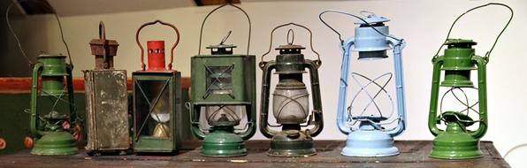 vintage kerosene lamps on a wooden table