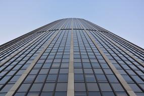 Low angle shot of the beautiful, glass Montparnasse Tower in Paris, France