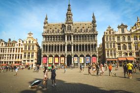 People, near the beautiful town hall in Brussels, Belgium