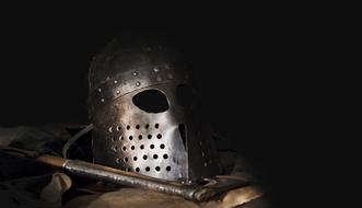 Viking helmet and axe, among the darkness