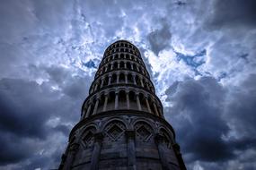 dramatic sky above the leaning tower of pisa