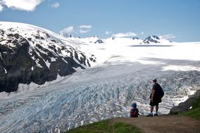 people looking at gorgeous Glacier from rock, usa, alaska, kenai fjords national park