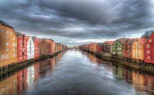 colorful buildings along a river in Norway