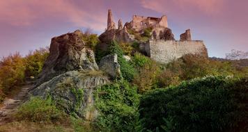 Ruins of Castle on hill at summer