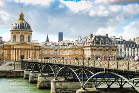 Pont des Arts or Passerelle des Arts, pedestrian bridge across seine river in city, France, Paris