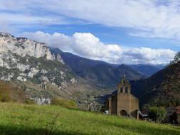 chapel in the mountains on a cloudy day