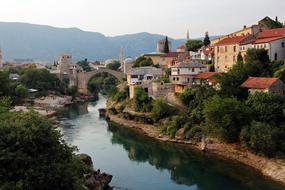 old stone bridge over the river in a medieval city