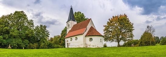 Beautiful church among the colorful plants in Bavaria, Germany