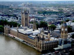 Beautiful cityscape of London with the Big Ben clock on the tower, and parliament, on the shore of the river, in England