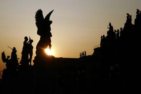 silhouettes of sculptures in berlin in the bright sun