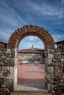 stone arch as an entrance to a medieval temple