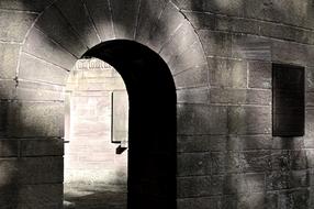 arched passage in a stone wall