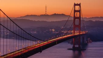 panoramic view of the golden gate bridge at orange sunset