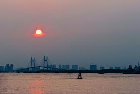 beautiful Sunset above the city with water