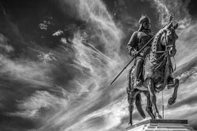 Horseman statue on a background of smoke