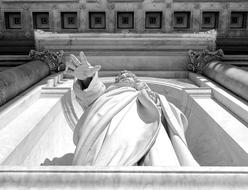 bottom view of male sculpture in Basilica di San Giovanni in Laterano, italy, Rome