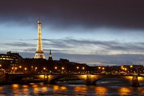 illuminated Eiffel Tower in Paris France at evening