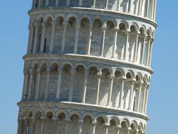 detail of leaning Pisa Tower at sky in italy