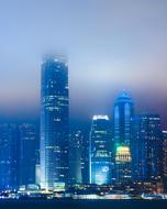 distant view of modern hong kong architecture on blue night