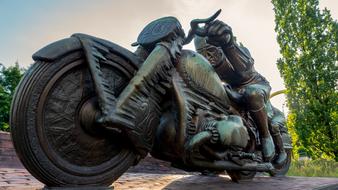 motorcyclist as a bronze sculpture