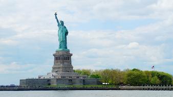 view from the water to the Statue of Liberty in New York