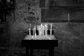 monochrome photo of Candles in Church