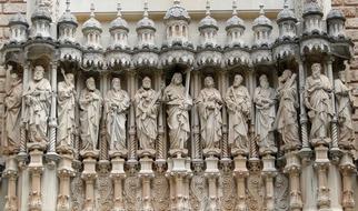 stone carved figures of saints on facade of Abbey of Montserrat, spain, barcelona