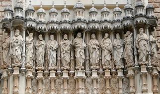 stone carved figures of saints on facade of Abbey of Montserrat, spain, barcelona