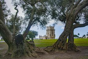 Beautiful architecture, among the green and yellow field and trees, in Belem, Portugal