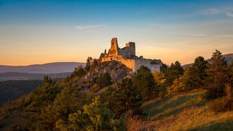 distant view of Bathory Castle at dusk