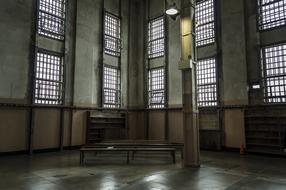 interior of an old prison with large windows