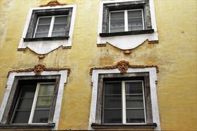 picturesque Windows with plaster decorating, Old Facade