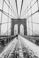 black and white winter photo of the Brooklyn Bridge