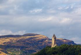 photo of a stone tower on a mountain in Scotland