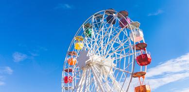 ferris wheel with colorful cabs in Barcelona