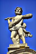 man with club on shoulder, stone Sculpture at sky