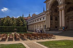 landscape of benches in garden and cathedral