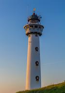 lighthouse on the north sea at sunset