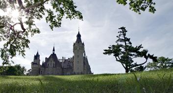 Beautiful landscape of the palace, among the green fields and trees in Silesia, Poland