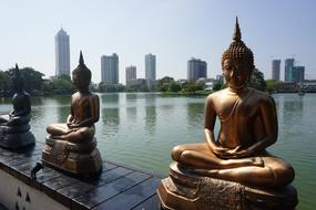 Statues Buddha river