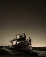 boat after shipwreck in monochrome