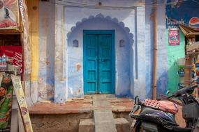 photo of blue entrance doors to a building in India