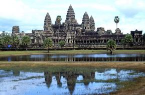 Beautiful Angkor Wat Temple and beautiful colorful river among the plants in Cambodia