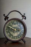 Antique alarm Clock with floral ornament