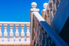 Beautiful white railing at blue sky background