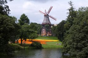 windmill near lake in park, Germany, Bremen
