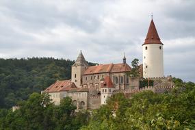 Photo of a medieval castle on a hill in the Czech Republic