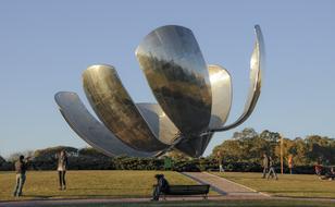 People, near the shiny monument in Buenos Aires, Argentina, among the colorful trees