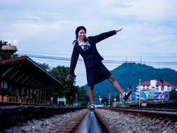 Student and railway tracks