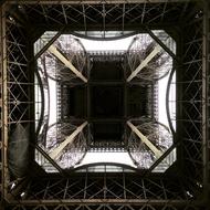 bottom view of the eiffel tower in the dark